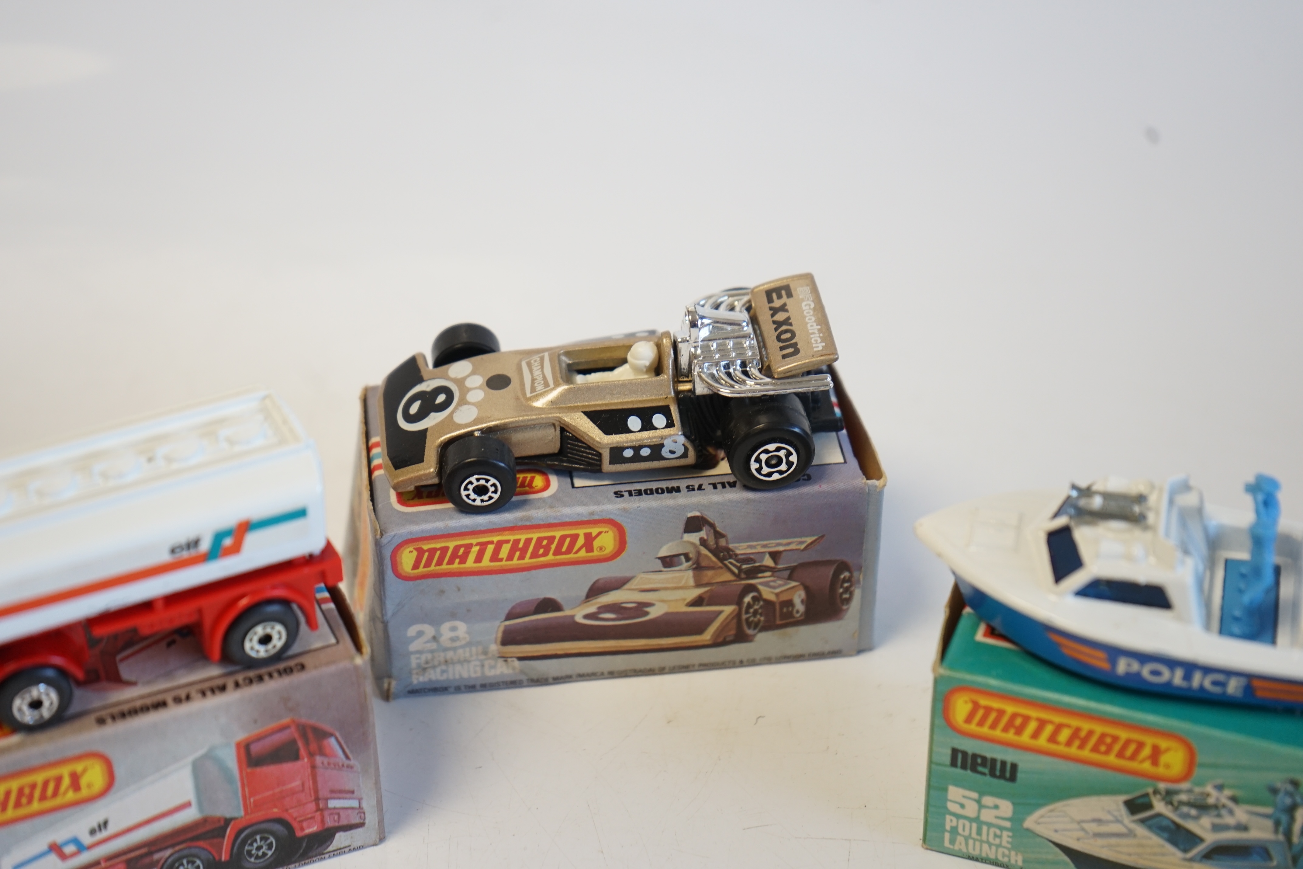 Seventeen boxed Matchbox Series 1-75 diecast vehicles including; 6; Mercedes Tourer, 9; Ford RS 2000, 10; Plymouth Police Car, 14; Petrol Tanker, 28; Formula One Racing Car and another, 30; Artic Truck, 30; Swamp Rat, 35